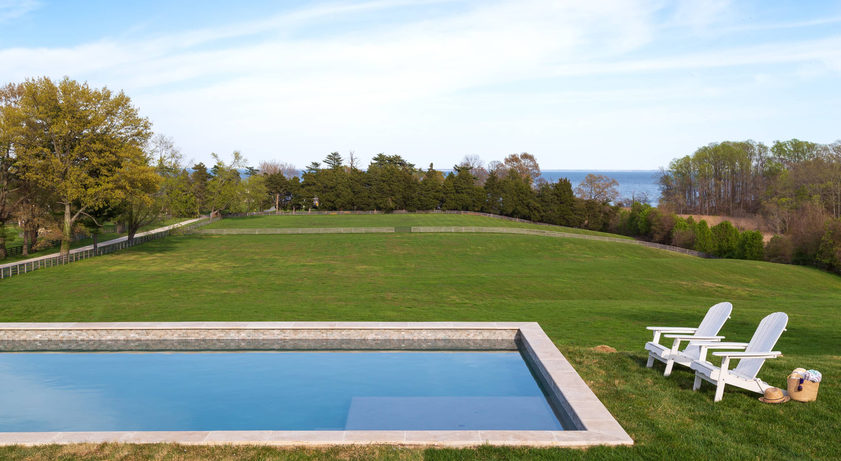 Pool and water view at Tacaro Estate in Tracys Landing, MD
